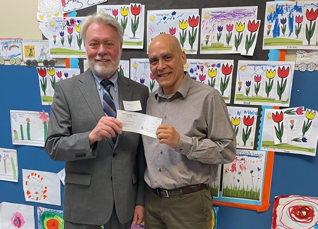 branch manager bill hason providing adonation to new beginnings family academy's art classrooms