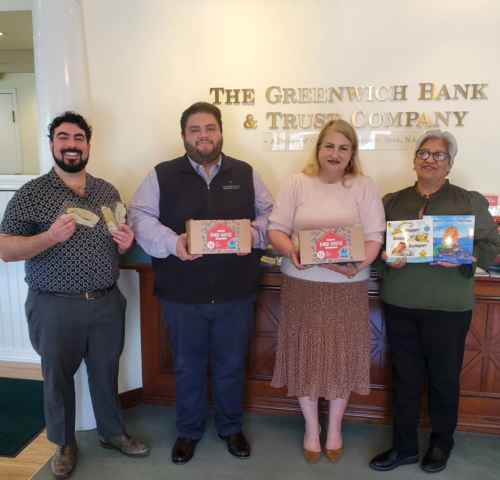 Bank donation to Family Centers of Greenwich of books, airplane kits and birdhouse kits for their Spring Family Literacy Program.